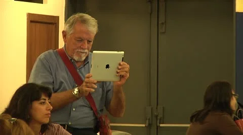Man holding Apple iPad, using digital tablet. Stock Footage