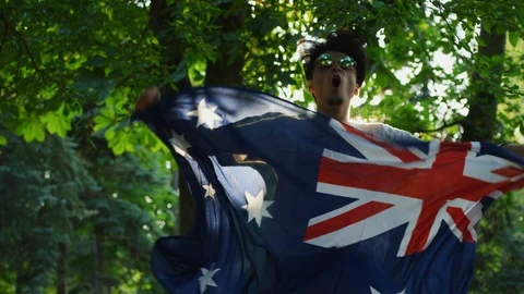 Man holding the Australian flag Stock Footage 99965575