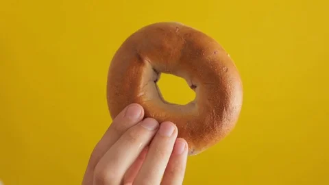 Man Holding Bagel Bread Stock Footage 95210429