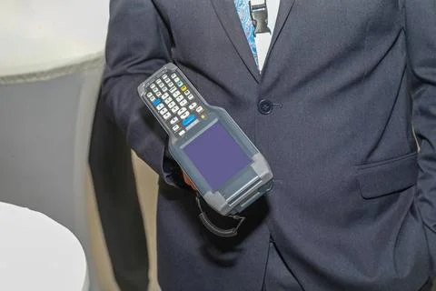 Man Holding Barcode Reader Man Holding Handheld Barcode Scanner Reader Por... Stock-Fotos