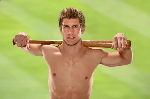 Man holding baseball bat on shoulders Stock Photos