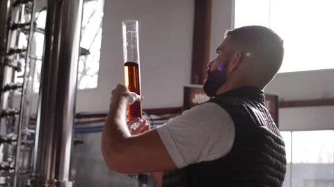 A man holding a beaker Stock Footage 137678677