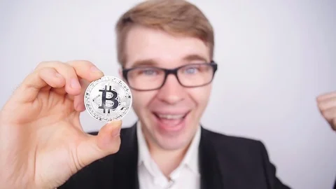Man holding bitcoin in his hand Stock-Footage 80273695