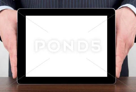 Man holding blank digital tablet on a desk Stock Photos