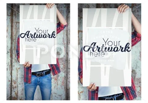 Man holding a blank placard in front of his face against wooden wall PSD Template