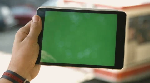 Man Holding Blank Tablet PC With Green Screen For Custom Content 4k 動画素材 66922668