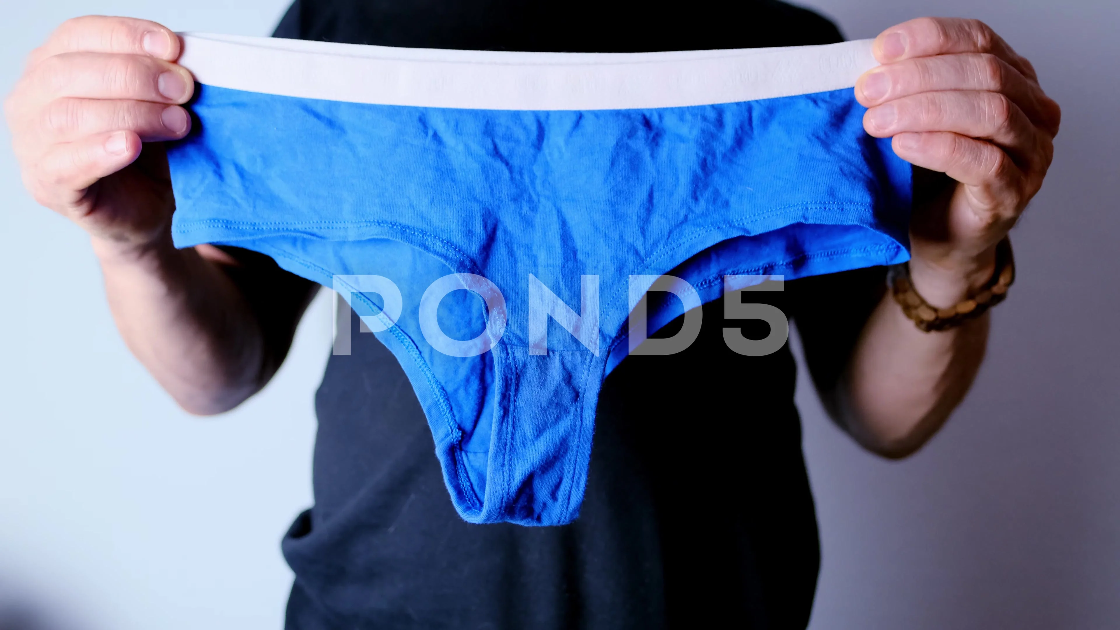 man holding blue women's panties in his , Stock Video