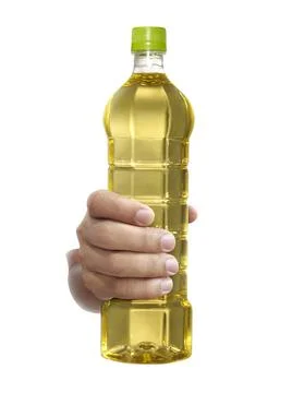 A man holding bottle of Palm kernel Cooking Oil isolated on white background Stock Photos
