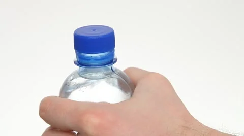 Man holding a bottle of water, opening and closing it Stock Footage 56829027