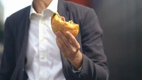 Man Holding A Burger Stock Footage 126128537