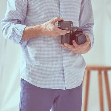 Man holding camera Stock Photos