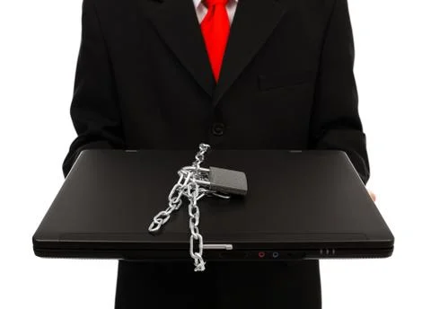 Man holding chained computer Stock Photos