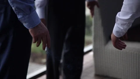 A man holding a cigarette Stock Footage 93834451
