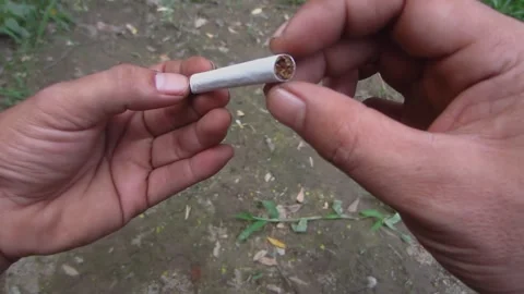 A man holding a cigarette Stock Footage 244998712