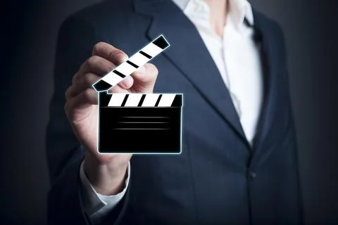 Man holding clapper board in screen Stock Photos