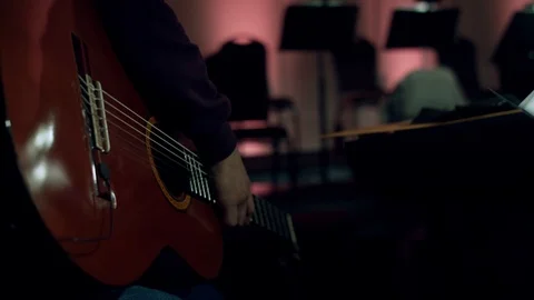 MAN HOLDING A CLASSICAL GUITAR Stock Footage 108393498