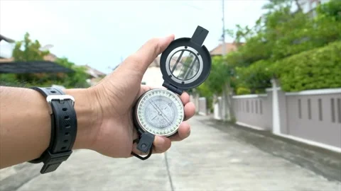Man holding compass on blurred background. for activity lifestyle Stock Footage 138913605