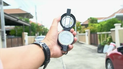 Man holding compass on blurred background. for activity lifestyle Stock Footage 138913672