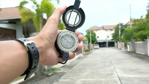 Man holding compass on blurred background. for activity lifestyle Stock Footage 138914050