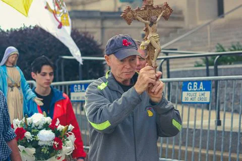 Man holding a cross Stock Photos