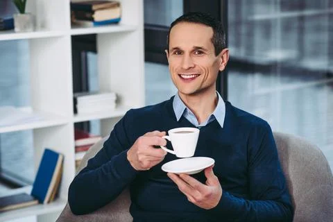 Man holding cup of coffee Stock Photos