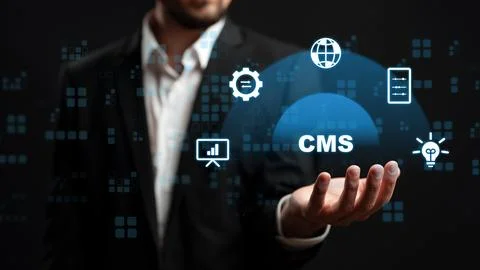 Man holding a digital representation of a content management system and its Stock Photos