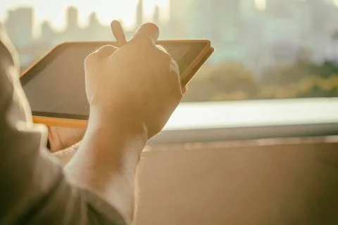Man holding digital tablet device in hands Stock Photos