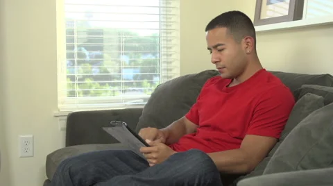 Man holding digital tablet reading Stock Footage 44113165