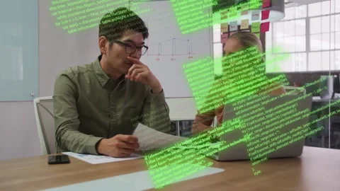 Man holding documents as woman typing on laptop activating code overlays, Stock Footage 333594940