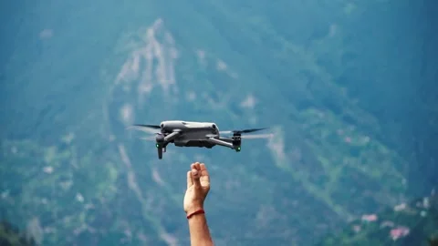 Man Holding a Drone in His Hand Before Flying Видео 316892265