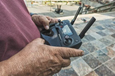 Man holding drone remote control. Stock Photos