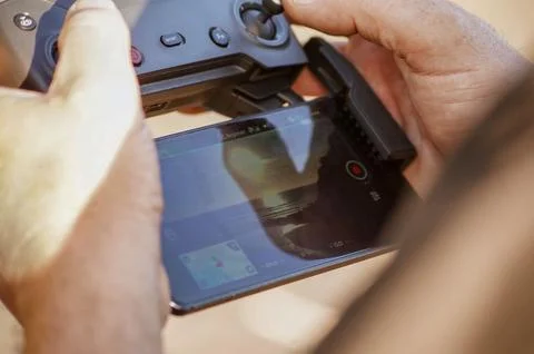 A man holding a drone remote control Stock Photos