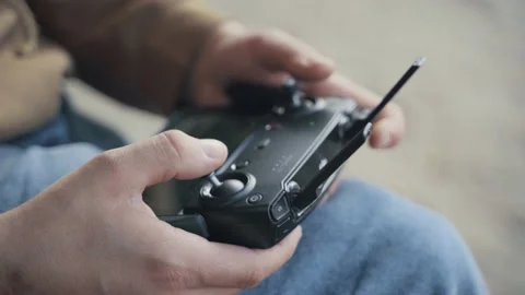 Man holding drone remote controller closeup Stock-Footage 143033633