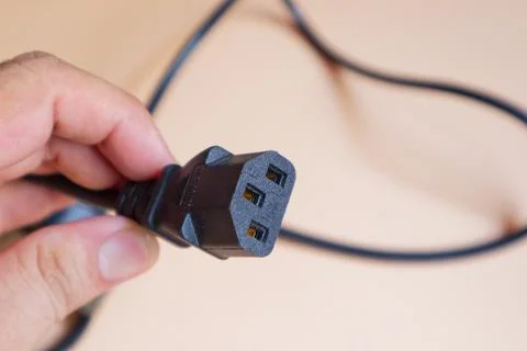 Man Holding Electric Power Plug - Energy Connection Concept Stock Photos