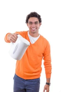 Man holding electrical kettle to pour boiling water Stock Photos
