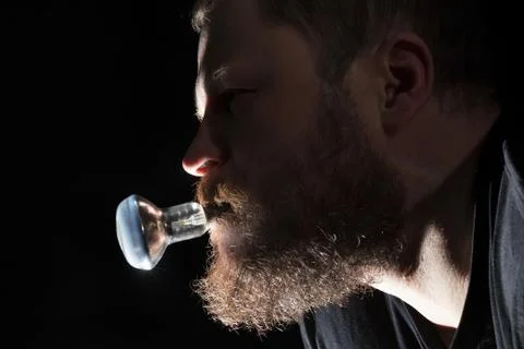 Man holding electrical lamp Stock Photos