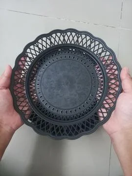 Man Holding Empty Black Woven Plastic Rattan Plate Close Up Stock Photos