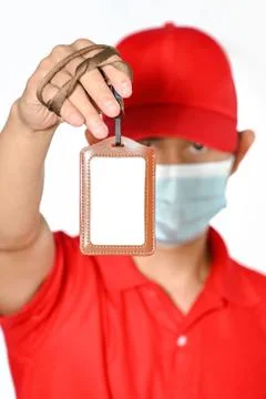 Man holding empty Identification ,white blank employee id card mockup Stock Photos