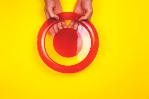 A man holding a empty plate. Stock Photos