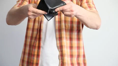 Man holding an empty purse Stock Footage 60408217