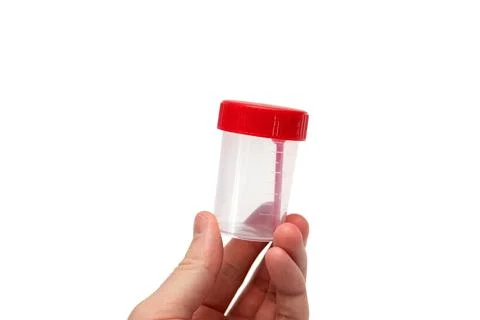 Man holding empty sample cup. Plastic container for medical tests isolated Stock Photos