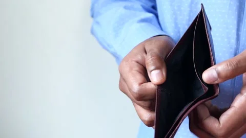 Man holding empty wallet open showing no money inside, financial problem co.. Stock Footage 332625234