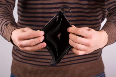 Man holding an empty wallet Stock Photos