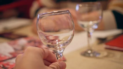 Man holding an empty wine glass, closeup shot of male hand cinematic 4K video Stock Footage 263931995