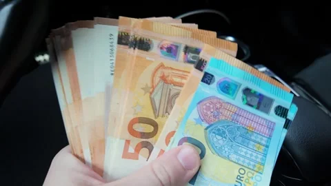 Man Holding Euro Banknotes Inside Car Showing Personal Finance And Wealth Stock Footage 339026961