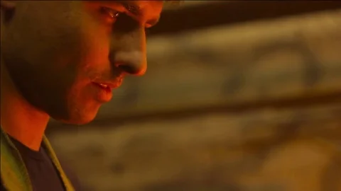 Man holding fire in the dark Stock Footage 75311201