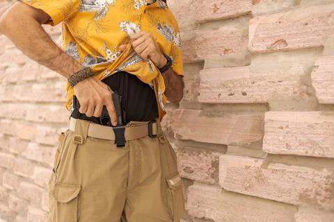 Man holding firearm Stock Photos