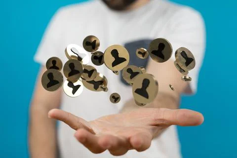 Man holding a floating render of the people avatar icons Stock Photos