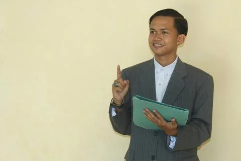 Man holding folder pointing up Stock Photos