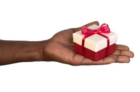 Man holding a gift box in hands isolated on white Stock Photos